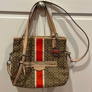 Coach purse with orange stripe.
